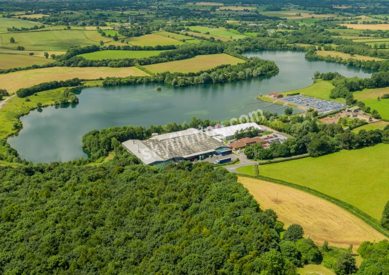 Treves factory from afar showing entire lake, drone aerial photograph
